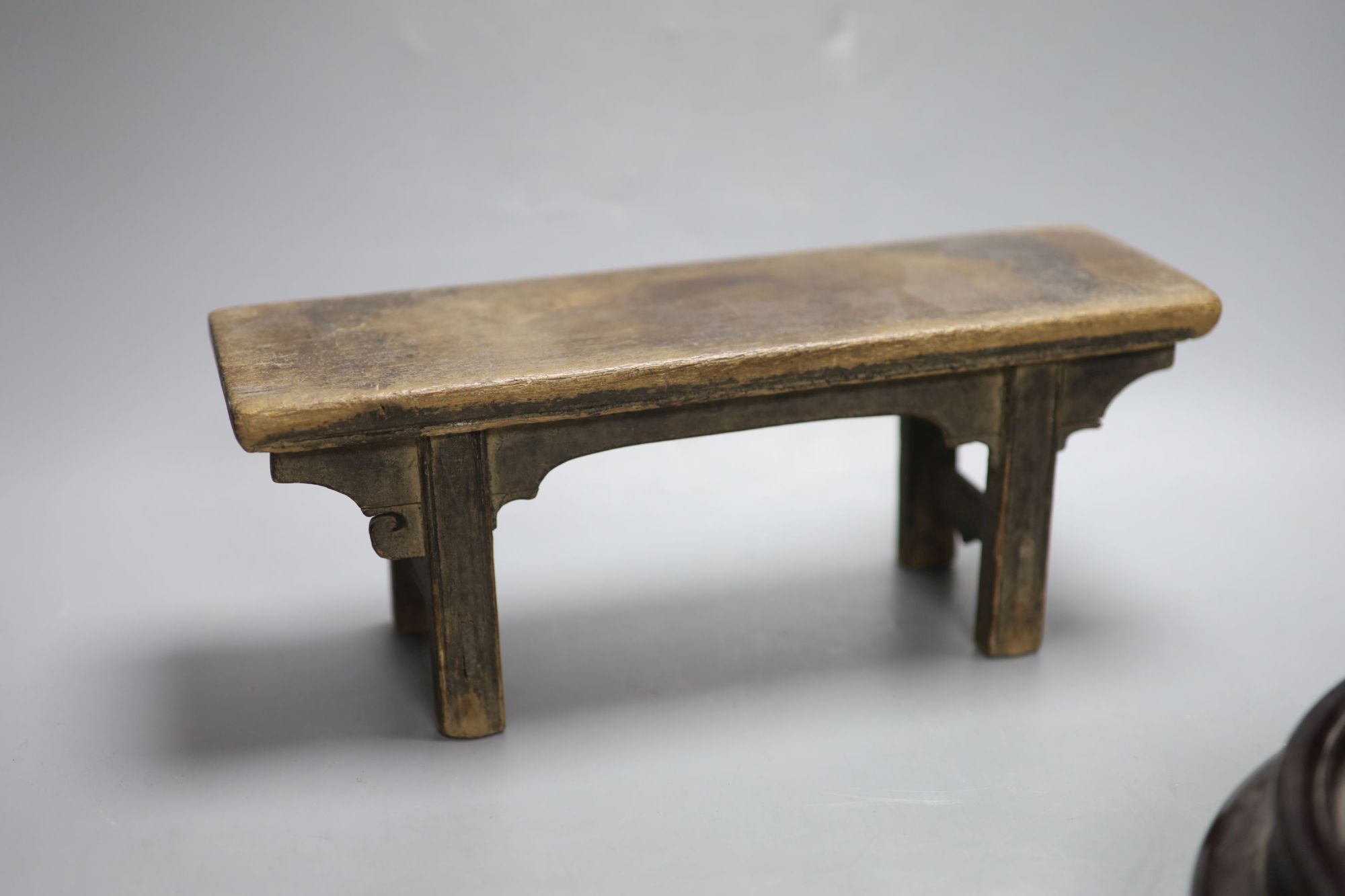 A Chinese wood model of an altar table and two wood stands, longest 33.5cm